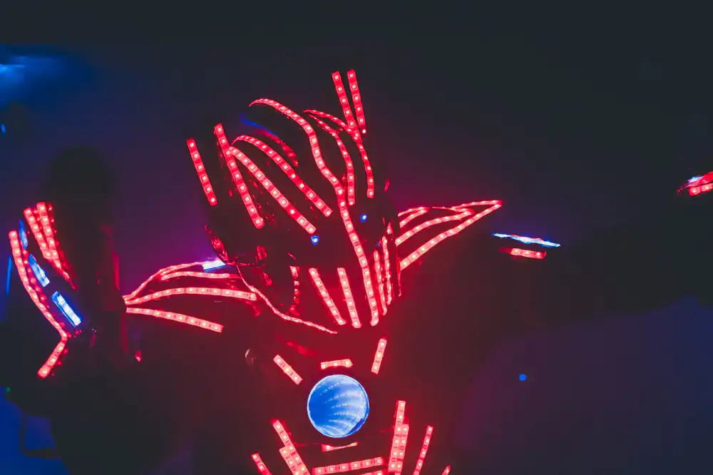 Gameplay screenshot showing a hero jumping across neon platforms