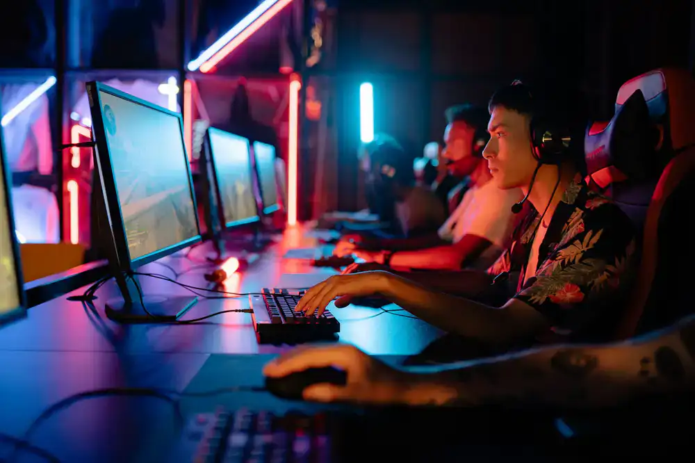 The Jumpcut Games team analyzing game levels on a monitor